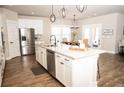 Modern kitchen with stainless steel appliances, granite countertops, and a center island with seating at 6340 Arlington Cir, Cumming, GA 30041