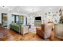 Bright living room with hardwood floors, a gallery wall and plush seating at 576 Tope Rd, Sharpsburg, GA 30277