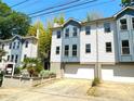 Charming townhome featuring a two-car garage and blue and white exterior paint at 738 Saint Charles Ne Ave, Atlanta, GA 30306