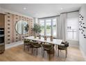 Dining room featuring modern lighting, designer wallpaper, and large windows for natural light at 1428 Wicker Wood Se Pl # 8, Smyrna, GA 30080