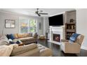 Inviting living room with a fireplace and large windows, offering ample natural light at 2136 Oak Knob Dr, Decatur, GA 30032