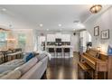 Bright, open-concept living area seamlessly connects to a modern kitchen with island seating at 2136 Oak Knob Dr, Decatur, GA 30032