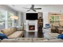 Cozy living room with a fireplace, large windows, and comfortable seating arrangements at 2136 Oak Knob Dr, Decatur, GA 30032