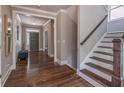 Inviting foyer with hardwood floors, staircase, and view of the front door at 2675 Sugar Mill Dr, Atlanta, GA 30316