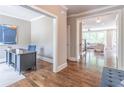 View from office to the living room, showcasing the open floor plan and hardwood floors at 2675 Sugar Mill Dr, Atlanta, GA 30316