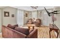 Cozy living room with hardwood floors, vintage furniture and natural light at 4076 Blanton Sw Ave, Atlanta, GA 30331