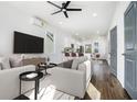 Bright living room featuring modern decor, hardwood floors, and a ceiling fan at 100 Dahlia Sw Ave, Atlanta, GA 30314
