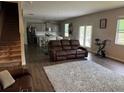 Open-concept living area with a view of the modern kitchen and dining area at 3604 Sw Wartrace Sw Dr, Atlanta, GA 30331