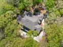 Overhead shot of home with black shingled roof surrounded by lush landscaping at 3500 Lost Valley Dr, Jonesboro, GA 30236