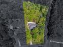 Aerial view of property surrounded by lush, mature trees offering great privacy at 3500 Lost Valley Dr, Jonesboro, GA 30236