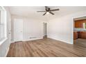 Spacious living room features new floors, fresh paint, and a modern ceiling fan at 1132 Luther Sw Dr, Mableton, GA 30126