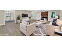 Bright living room featuring a fireplace, plush seating, and an open floor plan to the dining area at 486 Edward Ct, Marietta, GA 30066