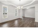 Elegant dining room featuring detailed trim, natural light, and hardwood flooring at 76 Parkview Dr, Dallas, GA 30157