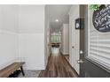 Inviting foyer with hardwood floors, a coat rack, and bright lighting leading into the living area at 8609 Lakeview, Jonesboro, GA 30238
