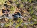 Aerial view showcasing the property's location, surrounding trees, and driveway at 1480 Niskey Lake Sw Rd, Atlanta, GA 30331