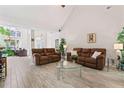 Bright living room features high ceilings, tile floors, neutral colors, and comfortable seating at 235 Huiet Dr, Mcdonough, GA 30252
