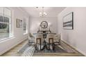 Elegant dining room with modern decor, ample natural light, a round table, and seating for six at 4549 Ajo Lot#30 Walk, Atlanta, GA 30331