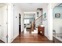 Inviting foyer featuring hardwood floors, staircase, and an open view into adjacent living spaces at 520 Tackett Farms Rd, Smyrna, GA 30082