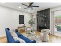 Bright living room with a fireplace, modern artwork, and comfortable seating at 1906 Variations Ne Dr, Atlanta, GA 30329