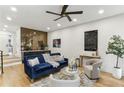 Cozy living room with a modern bar area, beautiful wall decor, and comfortable seating at 1906 Variations Ne Dr, Atlanta, GA 30329