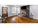 Cozy living room with hardwood floors, brick fireplace, and updated decor at 338 Patricia Sw Ave, Marietta, GA 30060