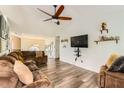 Spacious living room featuring plush furniture, a ceiling fan, and elegant decor at 7450 Chads Cir, Jonesboro, GA 30236