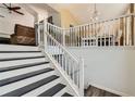 A staircase leading into a dining room featuring a neutral color palette and white accents at 7450 Chads Cir, Jonesboro, GA 30236