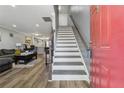 Inviting entryway with wood-look floors and staircase leading to upper level at 135 N North River Dr, Atlanta, GA 30350