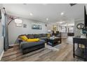 Comfortable living room with gray walls, wood-look floors, and ample seating at 135 N North River Dr, Atlanta, GA 30350