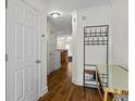 Inviting entryway with hardwood floors, coat rack, and modern decor elements for a stylish welcome at 5570 Stonewood Ct, Norcross, GA 30093