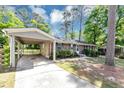 Inviting brick home with attached carport, offering a blend of comfort and convenience at 190 Sunrise Cir, Riverdale, GA 30274