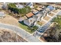 Aerial view showing the house situated on a corner lot, backing to neighboring yards with pools at 3564 Nathan Farm Ln, Buford, GA 30519