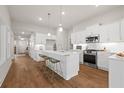 Modern kitchen with white cabinets, stainless steel appliances, and a center island with seating at 1220 Cedarcrest Blvd, Acworth, GA 30101