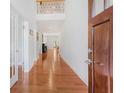 Inviting foyer with gleaming hardwood floors leading into an open-concept layout, enhanced by natural light and soaring ceilings at 1862 Lake Ebenezer Trl, Marietta, GA 30066