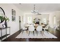 Elegant dining area featuring a modern table, stylish seating, and seamless flow into the adjacent living space at 2813 White Oak Ln, Decatur, GA 30032