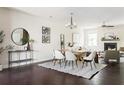 Bright dining area featuring hardwood floors, modern decor, and a stylish chandelier creating an inviting atmosphere at 2813 White Oak Ln, Decatur, GA 30032