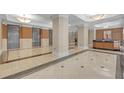 Grand lobby featuring elegant marble floors, elevator access, and a concierge desk at 3475 Oak Valley Rd # Apt 650, Atlanta, GA 30326