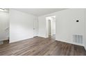 Spacious living room with wood-look flooring and ample natural light at 4282 Worth Nw St, Acworth, GA 30101