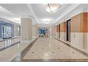 Elegant lobby with marble floors, refined columns, recessed lighting and a seating area at 3475 Oak Valley Rd # 660, Atlanta, GA 30326