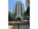 Exterior shot of a high-rise building with fountain and covered entry at 799 Hammond Dr # 321, Atlanta, GA 30328