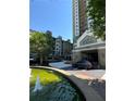 Exterior shot of buildings, fountain and covered entry at 799 Hammond Dr # 321, Atlanta, GA 30328