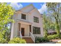Attractive two-story home with white siding, dark trim, and covered front porch at 842 Bridgewater Sw St, Atlanta, GA 30310