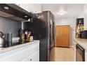 Close up view of kitchen with stainless steel appliances and white cabinets at 3925 Chicamauga Ne Dr, Kennesaw, GA 30144