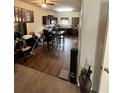 View from living area showing kitchen with dark wood cabinets and dining area at 4039 Braxton Sw Pl, Atlanta, GA 30331