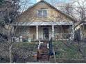 Charming two-story home with inviting front porch and mature trees at 939 Hank Aaron Sw Dr, Atlanta, GA 30315