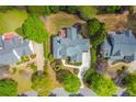 A bird's eye view of a neighborhood with well-manicured lawns, mature trees and custom homes at 3233 Bagley Psge, Duluth, GA 30097