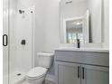 Modern bathroom featuring glass enclosed shower, a gray vanity and neutral decor at 2019 Fern Mountain Ln, Marietta, GA 30064