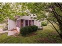 View of the back of the house including a screened in back porch area at 4715 Hill Rd, Powder Springs, GA 30127