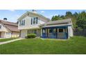 Charming two-story home with a one-car garage, landscaped yard, and a covered porch at 1248 To Lani Ct, Stone Mountain, GA 30083
