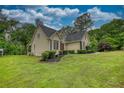 Well-maintained home with lush lawn and landscaping at 1761 Mcdaniel Mill Rd Sw, Conyers, GA 30094